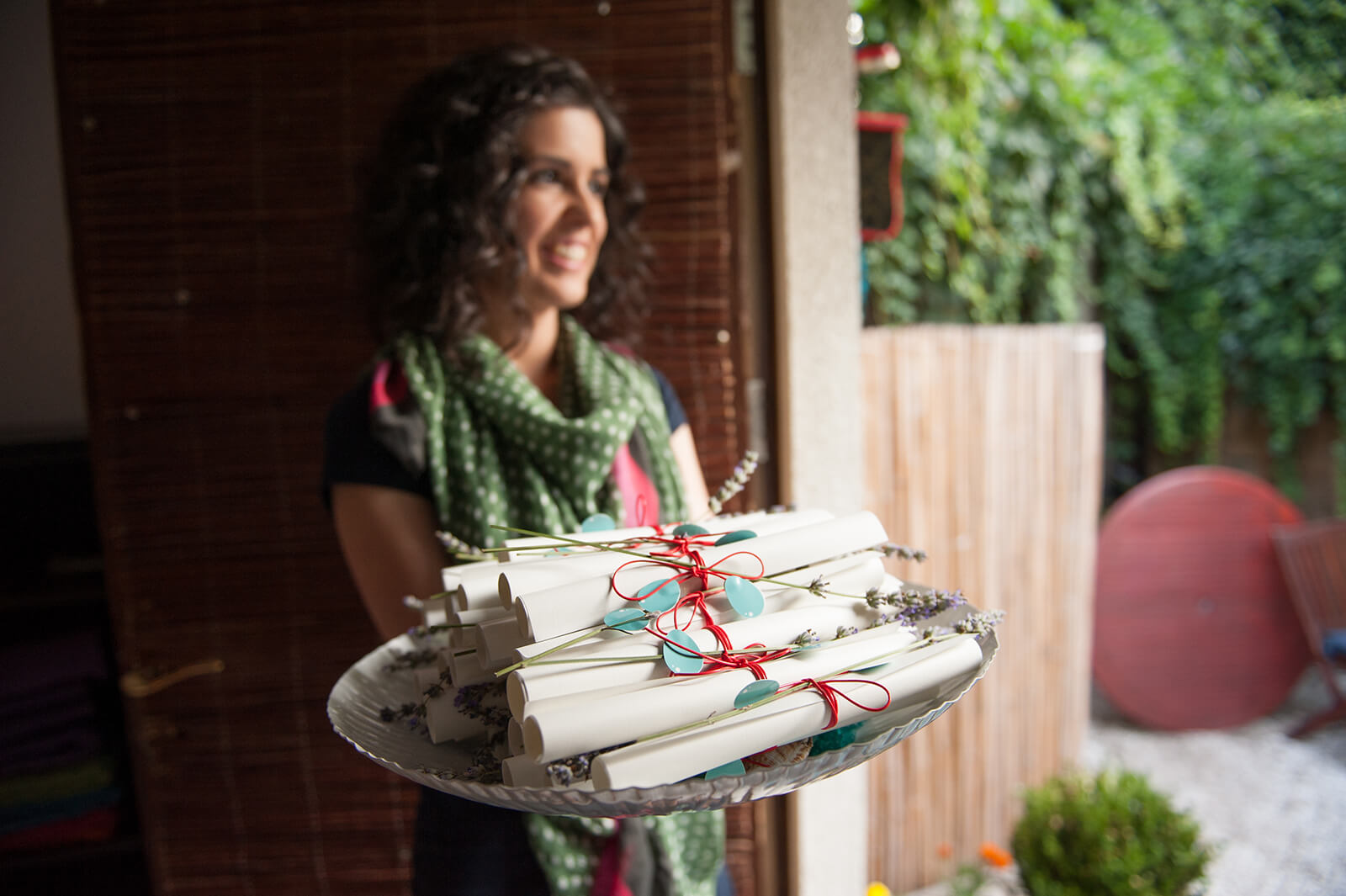 Adriana Liute holding the 40 individual stories on a platter